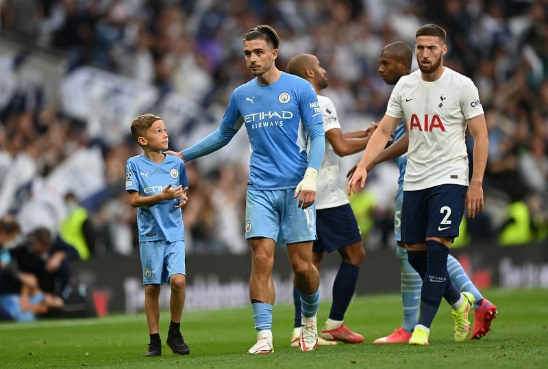 Manchester City's Jack Grealish (centre) walks off the pitch after the match against Tottenham